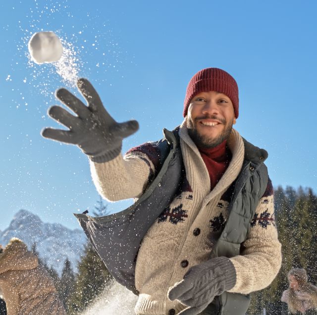 man-throwing-snowball-royalty-free-image-1610455842_