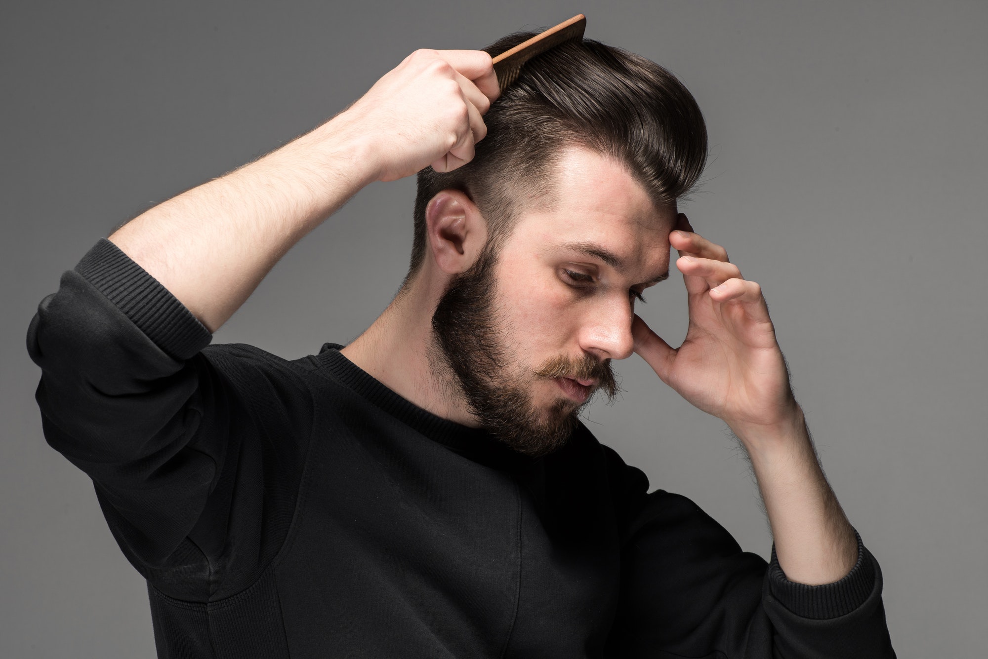 young man comb his hair